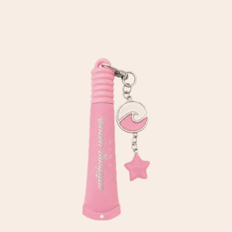A pink lip gloss on a keyring, with an enamel wave charm and a pink star