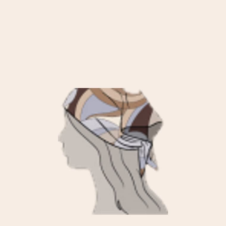 The hair wrap tied over the head, in a tan, brown and pale blue swirl print
