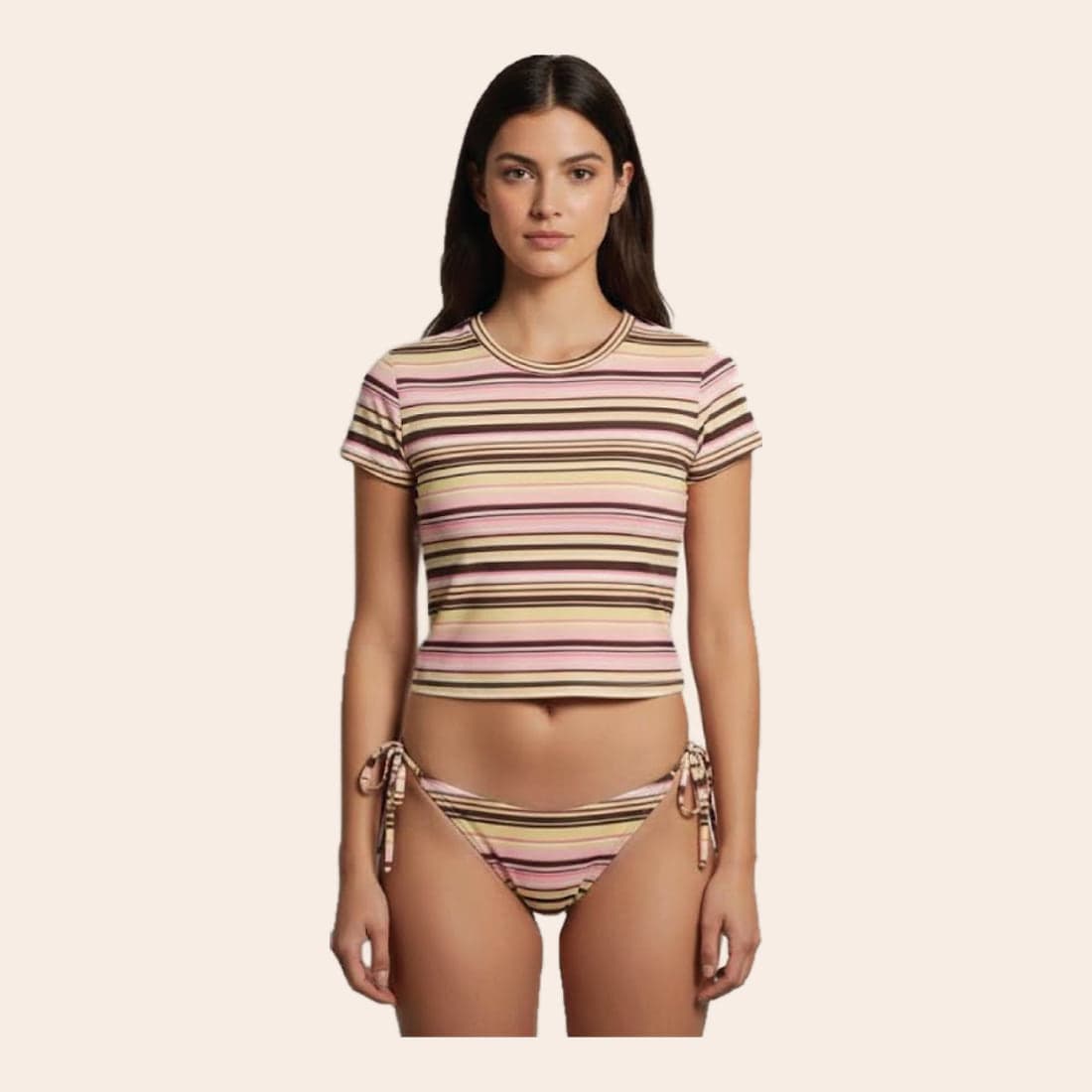 A model in a cropped striped swim tee over a matching tie-side bikini bottom